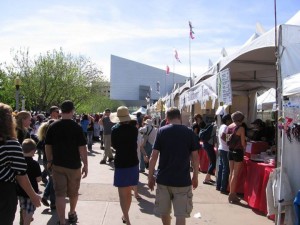 A festival at The Square PHX with the Science Center in the background.