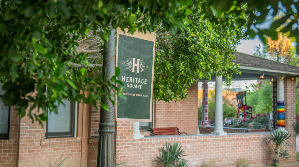 A picture of the museum store, with a green and gold banner in the foreground.