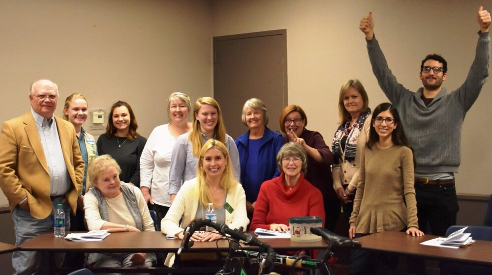 A group picture of The Square PHX volunteers at an educational event.