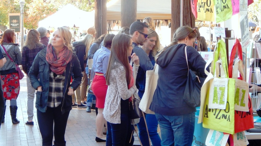 A festival at The Square PHX with lots of people and bright colors.