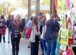 A festival at The Square PHX with lots of people and bright colors.