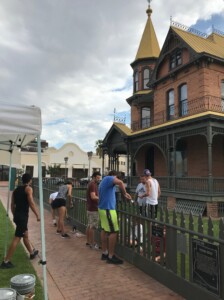 The Square PHX volunteers painting the Rosson House fence.