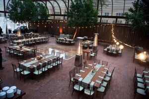 Tables and chairs set up for a wedding reception at The Square PHX's Lath Pavilion.