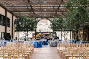 Chairs set up for a wedding at The Square PHX's Lath Pavilion, with tables and a food truck in the back ground for the reception.