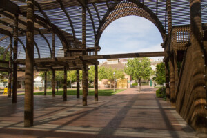 Under the shade of The Square PHX's Lath Pavilion, looking back towards the Visitor Center Carriage House.