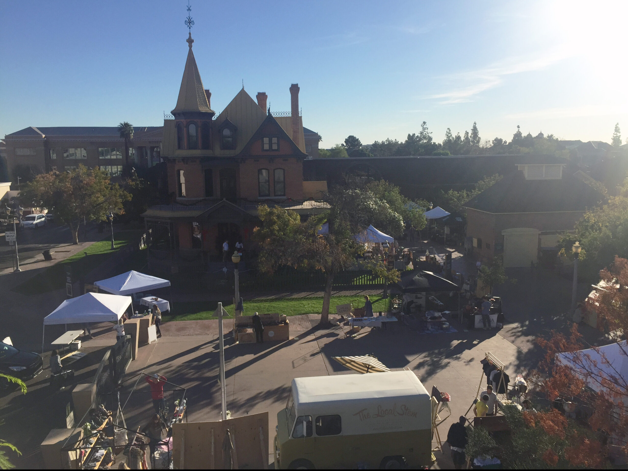 A picture of a festival at historic The Square PHX, with Rosson House in the background.