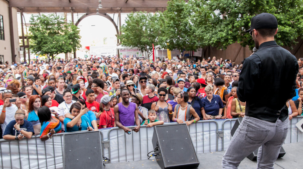 A packed crowd waits for a concert to start during a festival at the The Square PHX Lath Pavilion.