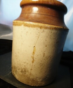 A large antique stoneware crock.