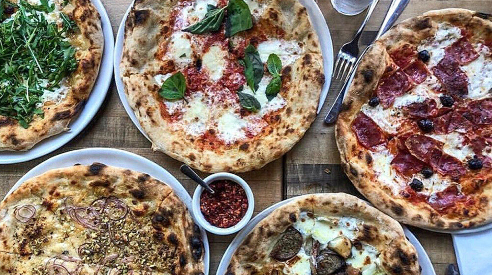 A picture of several types of delicious looking pizzas at Pizzeria Bianco.