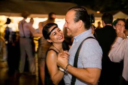 A picture of two people smiling and dancing at a The Square PHX event.