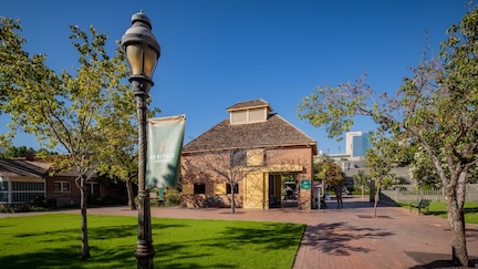 A picture of the Burgess Carriage House, where The Square PHX's Visitor Center is located.